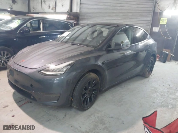 2023 Tesla Model Y Long Range with VIN 7SAYGDEE3PA034830, listed as a IAAI auction lot 41351397 with 26,704 mi miles. Bid and sale history available at carsss.com. Image 2.