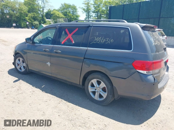 2010 Honda Odyssey Touring z VIN 5FNRL3H90AB085105, wystawiony jako IAAI lot #42142123 z przebiegiem Nie podano mil oraz . Historia ofert i sprzedaży dostępna na DreamBid. Obrazek 3.