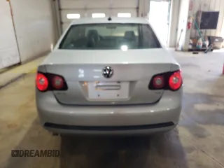 2009 Volkswagen Jetta z VIN 3VWAL71KX9M072304, wystawiony jako Copart lot #57027785 z przebiegiem 191 554 mil mil oraz Szkoda całkowita • Salvage title. Historia ofert i sprzedaży dostępna na DreamBid. Obrazek 6.