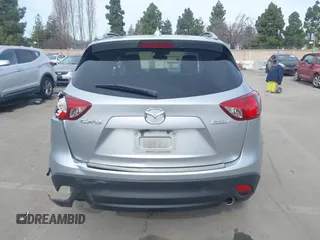2016 Mazda CX-5 Grand Touring with VIN JM3KE2DY9G0723921, listed as a IAAI auction lot 41681522 with 83,893 mi miles. Bid and sale history available at carsss.com. Image 16.