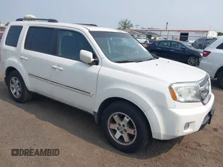 2011 Honda Pilot Touring z VIN 5FNYF4H9XBB003469, wystawiony jako IAAI lot #42369323 z przebiegiem 201 958 mil mil oraz . Historia ofert i sprzedaży dostępna na DreamBid. Obrazek 1.