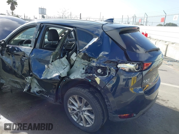 2021 Mazda CX-5 Grand Touring with VIN JM3KFBDM6M1312573, listed as a IAAI auction lot 41936739 with Not Provided miles and . Bid and sale history available at DreamBid. Image 6.