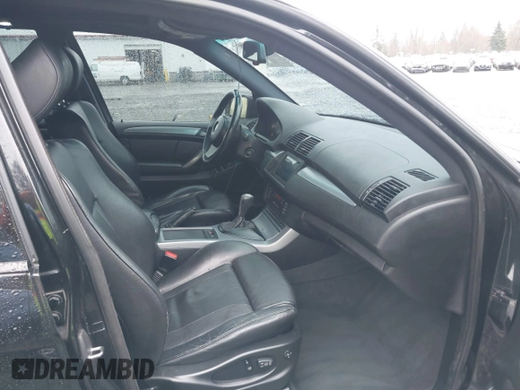 2005 BMW X5 4.8is with VIN 5UXFA93515LE82570, listed as a IAAI auction lot 41759657 with 212,687 mi miles. Bid and sale history available at carsss.com. Image 5.