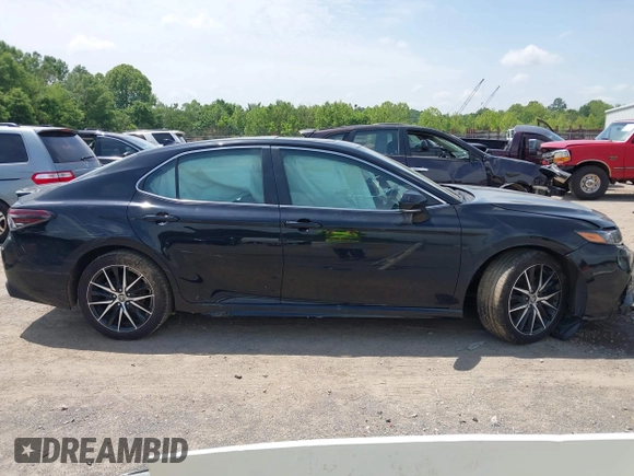 2023 Toyota Camry SE z VIN 4T1T11AK9PU721786, wystawiony jako IAAI lot #42279812 z przebiegiem 30 707 mil mil oraz . Historia ofert i sprzedaży dostępna na DreamBid. Obrazek 13.