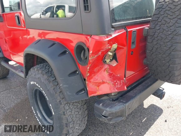 2002 Jeep Wrangler X with VIN 1J4FA39S02P739211, listed as a IAAI auction lot 41665910 with 144,118 mi miles. Bid and sale history available at carsss.com. Image 6.