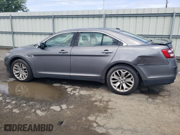 2014 Ford Taurus Limited with VIN 1FAHP2F84EG149622, listed as a Copart auction lot 63764675 with 208,801 mi miles and Salvage title. Bid and sale history available at DreamBid. Image 2.