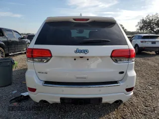 2019 Jeep Grand Cherokee Overland with VIN 1C4RJFCT2KC834690, listed as a Copart auction lot 84303144 with 63,053 mi miles and Salvage Title. Bid and sale history available at carsss.com. Image 6.
