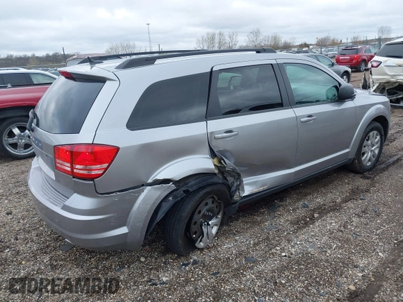 2016 Dodge Journey SE with VIN 3C4PDCAB4GT230643, listed as a IAAI auction lot 39127555 with 102,756 mi miles. Bid and sale history available at carsss.com. Image 4.