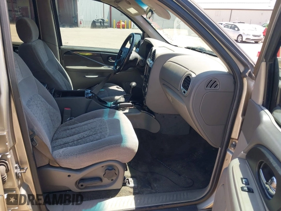 2003 GMC Envoy SLT with VIN 1GKDS13S732150215, listed as a IAAI auction lot 42048209 with 329,719 mi miles. Bid and sale history available at carsss.com. Image 5.