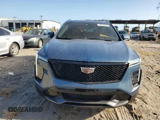 2024 Cadillac XT4 FWD Sport with VIN 1GYFZER40RF249101, listed as a Copart auction lot 76312304 with 1,969 mi miles and Salvage title. Bid and sale history available at DreamBid. Image 5.