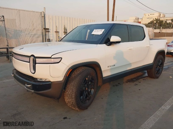 2024 Rivian R1T Adventure with VIN 7FCTGBAA8RN034385, listed as a IAAI auction lot 41302496 with 10,573 mi miles. Bid and sale history available at carsss.com. Image 2.