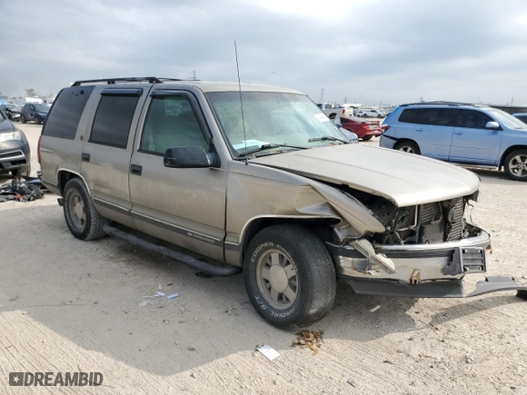 1999 Chevrolet Tahoe with VIN 1GNEC13R9XJ557532, listed as a Copart auction lot 44948845 with 215,360 mi miles and Salvage Title. Bid and sale history available at carsss.com. Image 4.