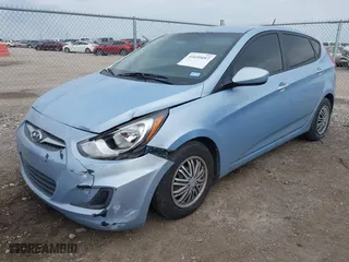 2014 Hyundai Accent GS with VIN KMHCT5AE1EU147015, listed as a IAAI auction lot 41659497 with 147,832 mi miles. Bid and sale history available at carsss.com. Image 2.