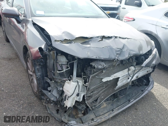 2019 Toyota Camry LE with VIN 4T1B11HK4KU254853, listed as a IAAI auction lot 42013255 with 153,664 mi miles and . Bid and sale history available at DreamBid. Image 6.