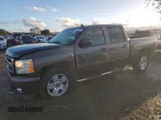 2007 Chevrolet Silverado 1500 Work Truck with VIN 2GCEC13J571550686, listed as a Copart auction lot 86720974 with 141,136 mi miles and Salvage Title. Bid and sale history available at DreamBid. Image 1.