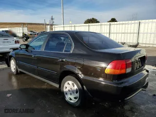 1997 Honda Civic EX with VIN 1HGEJ8646VL033197, listed as a Copart auction lot 84891944 with 0 mi miles and Salvage Title. Bid and sale history available at carsss.com. Image 2.