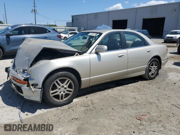 2000 Mazda Millenia with VIN JM1TA2210Y1614967, listed as a Copart auction lot 53606185 with 120,288 mi miles and Salvage Title. Bid and sale history available at DreamBid. Image 1.