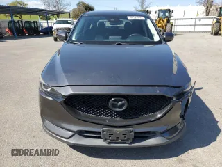 2017 Mazda CX-5 Touring with VIN JM3KFACLXH0131443, listed as a Copart auction lot 48524845 with 102,731 mi miles and Salvage Title. Bid and sale history available at carsss.com. Image 5.