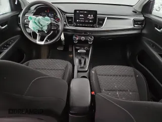 2023 Kia Rio LX with VIN 3KPA24AD0PE566085, listed as a Copart auction lot 50354455 with 65,203 mi miles and Salvage Title. Bid and sale history available at DreamBid. Image 8.
