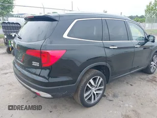 2017 Honda Pilot Touring with VIN 5FNYF6H90HB052474, listed as a IAAI auction lot 42291464 with 103,288 mi miles and . Bid and sale history available at DreamBid. Image 4.