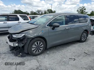 2023 Chrysler Pacifica Hybrid Touring L with VIN 2C4RC1L70PR554281, listed as a Copart auction lot 56867205 with 16,420 mi miles and Salvage Title. Bid and sale history available at DreamBid. Image 1.