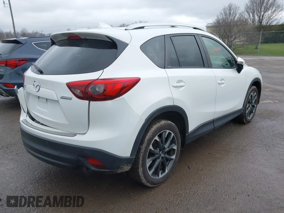 2016 Mazda CX-5 Grand Touring z VIN JM3KE4DY0G0705884, wystawiony jako IAAI lot #42016910 z przebiegiem 73 324 mil mil oraz . Historia ofert i sprzedaży dostępna na DreamBid. Obrazek 4.