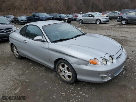2001 Hyundai Tiburon with VIN KMHJG35F31U224416, listed as a Copart auction lot 83243684 with 59,473 mi miles and Salvage Title. Bid and sale history available at carsss.com. Image 4.