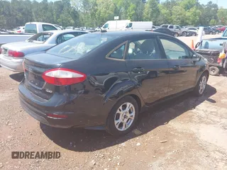 2015 Ford Fiesta SE with VIN 3FADP4BJ9FM113645, listed as a IAAI auction lot 41970671 with 138,026 mi miles. Bid and sale history available at carsss.com. Image 4.