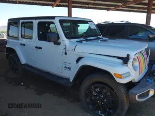2023 Jeep Wrangler Sahara with VIN 1C4JJXP66PW605202, listed as a IAAI auction lot 42099228 with 19,038 mi miles and . Bid and sale history available at DreamBid. Image 1.