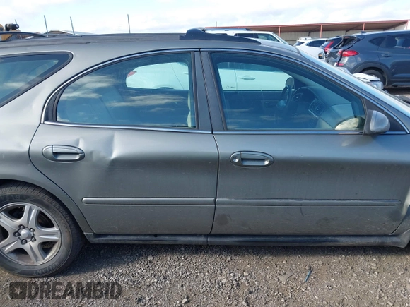 2002 Ford Taurus z VIN 1FAHP59SX2G137396, wystawiony jako IAAI lot #41661425 z przebiegiem 155 789 mil mil oraz . Historia ofert i sprzedaży dostępna na DreamBid. Obrazek 14.
