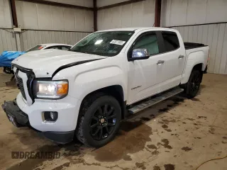 2018 GMC Canyon 4WD Denali z VIN 1GTG6EEN6J1171037, wystawiony jako Copart lot #52521865 z przebiegiem 99 931 mil mil oraz Szkoda całkowita • Salvage title. Historia ofert i sprzedaży dostępna na DreamBid. Obrazek 1.