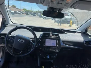 2021 Toyota Prius L Eco with VIN JTDKAMFU5M3140864, listed as a IAAI auction lot 42762749 with 70,256 mi miles and . Bid and sale history available at DreamBid. Image 1.