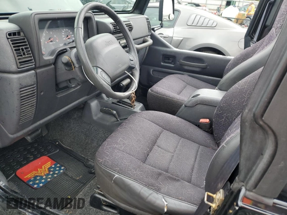 2002 Jeep Wrangler Sport with VIN 1J4FA49S12P730135, listed as a Copart auction lot 54477835 with 148,153 mi miles and Salvage title. Bid and sale history available at DreamBid. Image 7.