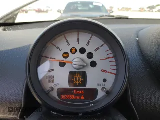 2013 MINI Countryman S ALL4 z VIN WMWZC5C56DWM16296, wystawiony jako Copart lot #56985615 z przebiegiem 63 858 mil mil oraz Szkoda całkowita • Salvage title. Historia ofert i sprzedaży dostępna na DreamBid. Obrazek 9.