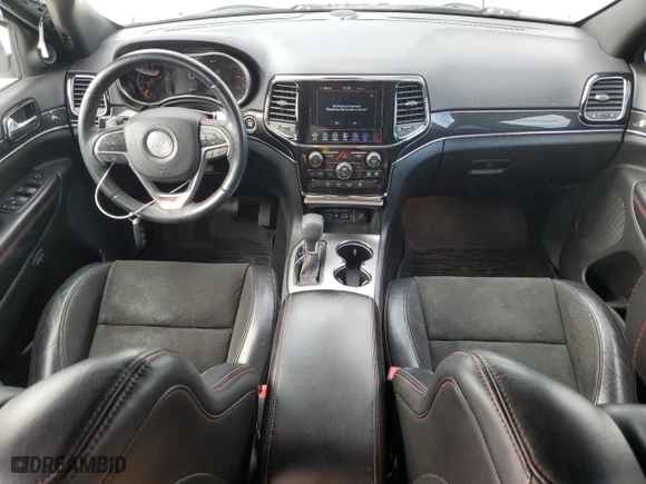 2019 Jeep Grand Cherokee Trailhawk with VIN 1C4RJFLT5KC645905, listed as a Copart auction lot 77326424 with 76,693 mi miles and Salvage Title. Bid and sale history available at carsss.com. Image 8.