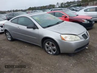 2006 Pontiac G6 GT with VIN 1G2ZH158X64146867, listed as a IAAI auction lot 41927729 with 999,999 mi miles. Bid and sale history available at carsss.com. Image 1.