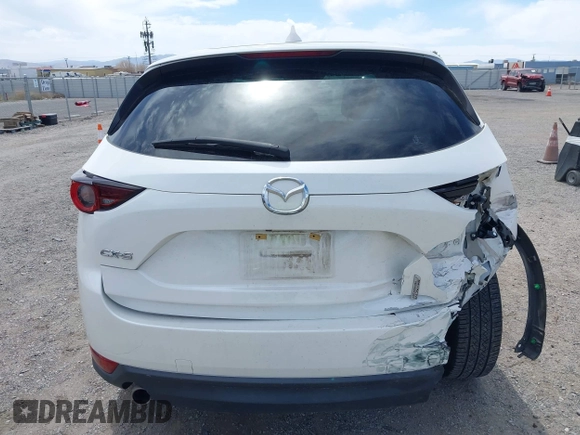 2018 Mazda CX-5 Touring with VIN JM3KFACM3J0381122, listed as a IAAI auction lot 42023838 with 76,121 mi miles. Bid and sale history available at carsss.com. Image 16.