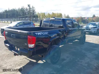 2016 Toyota Tacoma SR5 with VIN 5TFDZ5BN7GX001869, listed as a IAAI auction lot 40610002 with 184,380 mi miles. Bid and sale history available at carsss.com. Image 4.