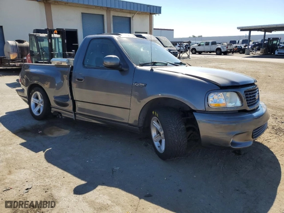 2004 Ford F-150 Heritage Lightning with VIN 2FTRF07354CA69559, listed as a Copart auction lot 73999214 with 256,082 mi miles and Salvage Title. Bid and sale history available at carsss.com. Image 4.