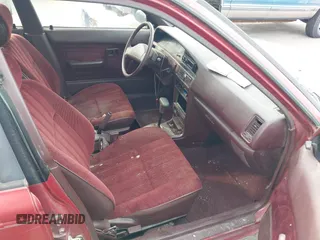 1991 Toyota Corolla z VIN 1NXAE94AXMZ209706, wystawiony jako IAAI lot #42099208 z przebiegiem 192 222 mil mil oraz . Historia ofert i sprzedaży dostępna na DreamBid. Obrazek 5.