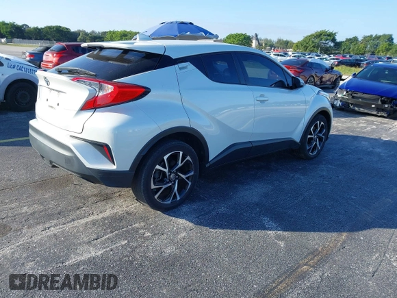 2021 Toyota C-HR LE with VIN NMTKHMBX0MR123981, listed as a IAAI auction lot 41273382 with 51,988 mi miles. Bid and sale history available at carsss.com. Image 4.