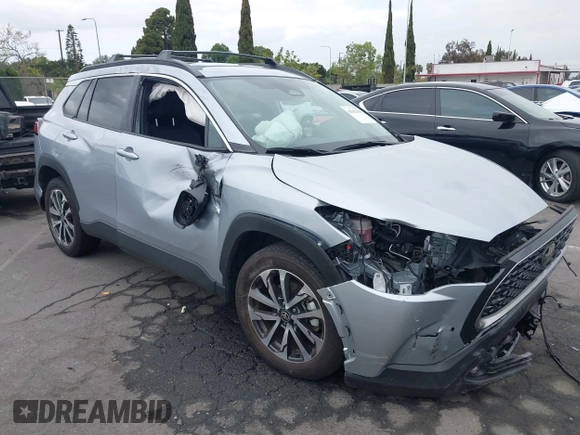 2023 Toyota Corolla Cross XLE with VIN 7MUEAABG8PV077117, listed as a IAAI auction lot 42052305 with 21,571 mi miles and . Bid and sale history available at DreamBid. Image 12.