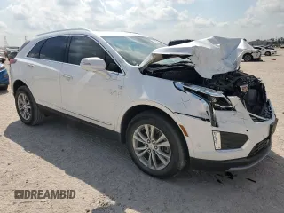 2023 Cadillac XT5 FWD Premium Luxury with VIN 1GYKNCRS7PZ150378, listed as a Copart auction lot 71792184 with 21,631 mi miles and Salvage Title. Bid and sale history available at carsss.com. Image 4.