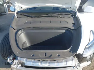 2023 Tesla Model Y Long Range with VIN 7SAYGDEE1PA128818, listed as a IAAI auction lot 41622062 with 19,089 mi miles. Bid and sale history available at carsss.com. Image 10.