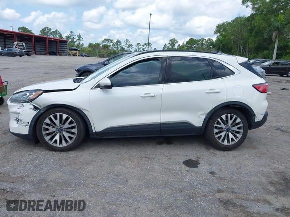 2020 Ford Escape Titanium Hybrid with VIN 1FMCU0DZ3LUC07842, listed as a IAAI auction lot 42456359 with 62,756 mi miles and . Bid and sale history available at DreamBid. Image 15.