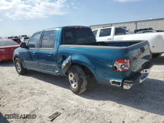 2001 Ford F-150 SuperCrew XLT with VIN 1FTRW07W61KF51152, listed as a Copart auction lot 76799164 with 154,718 mi miles and Salvage Title. Bid and sale history available at carsss.com. Image 2.