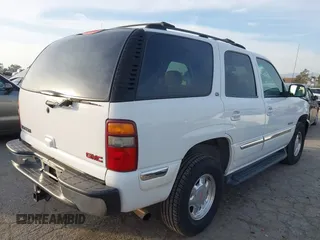 2001 GMC Yukon SLT with VIN 1GKEK13T41R171024, listed as a IAAI auction lot 41582633 with 216,077 mi miles. Bid and sale history available at carsss.com. Image 4.