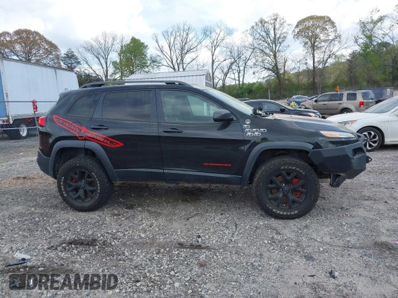 2015 Jeep Cherokee Trailhawk with VIN 1C4PJMBS5FW792184, listed as a IAAI auction lot 41827106 with 132,752 mi miles. Bid and sale history available at carsss.com. Image 13.