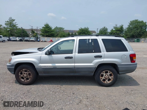 2002 Jeep Grand Cherokee Laredo with VIN 1J4GW48SX2C313093, listed as a IAAI auction lot 42446559 with 200,319 mi miles and . Bid and sale history available at DreamBid. Image 14.