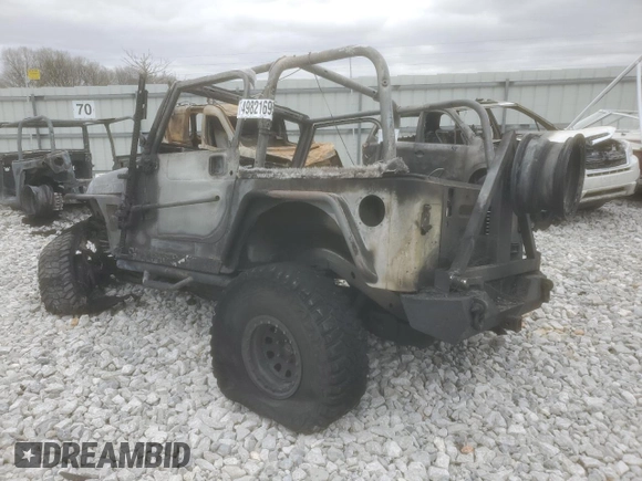 2004 Jeep Wrangler Rubicon with VIN 1J4FA69S74P787812, listed as a Copart auction lot 49821695 with Not provided miles and Salvage title. Bid and sale history available at DreamBid. Image 2.